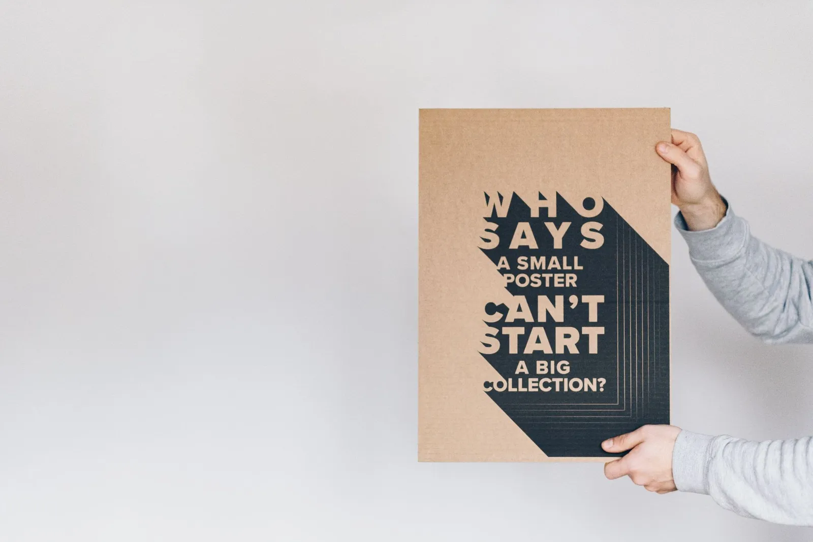 Man holding a placard with a large question mark, representing the “what do I look at first?” confusion that visual hierarchy solves