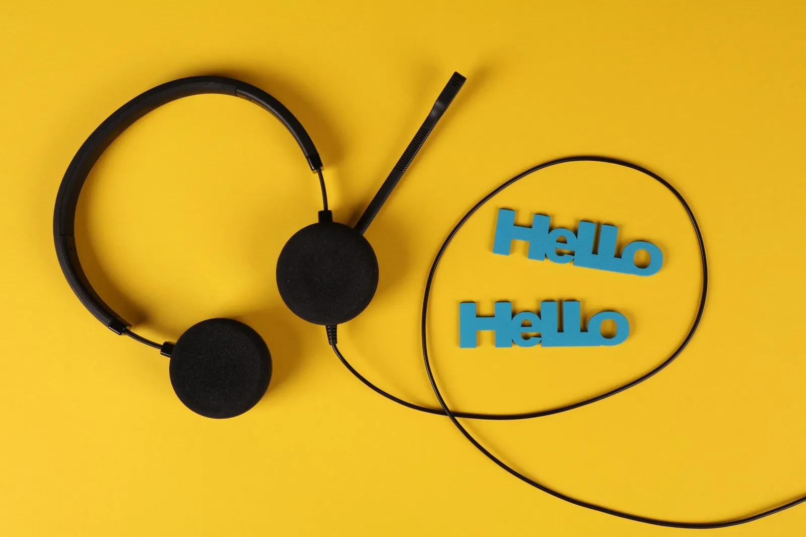 Close-up of a white headset surrounded by generous empty background, illustrating the interplay of positive and negative space