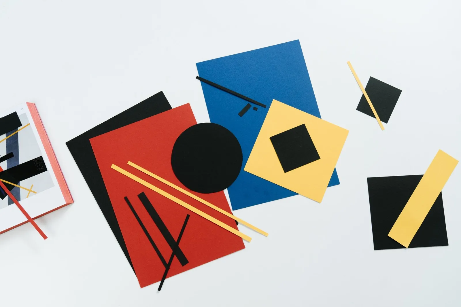 Blue, orange, and yellow triangle illustration with evenly distributed shapes, demonstrating balanced visual weight in a composition